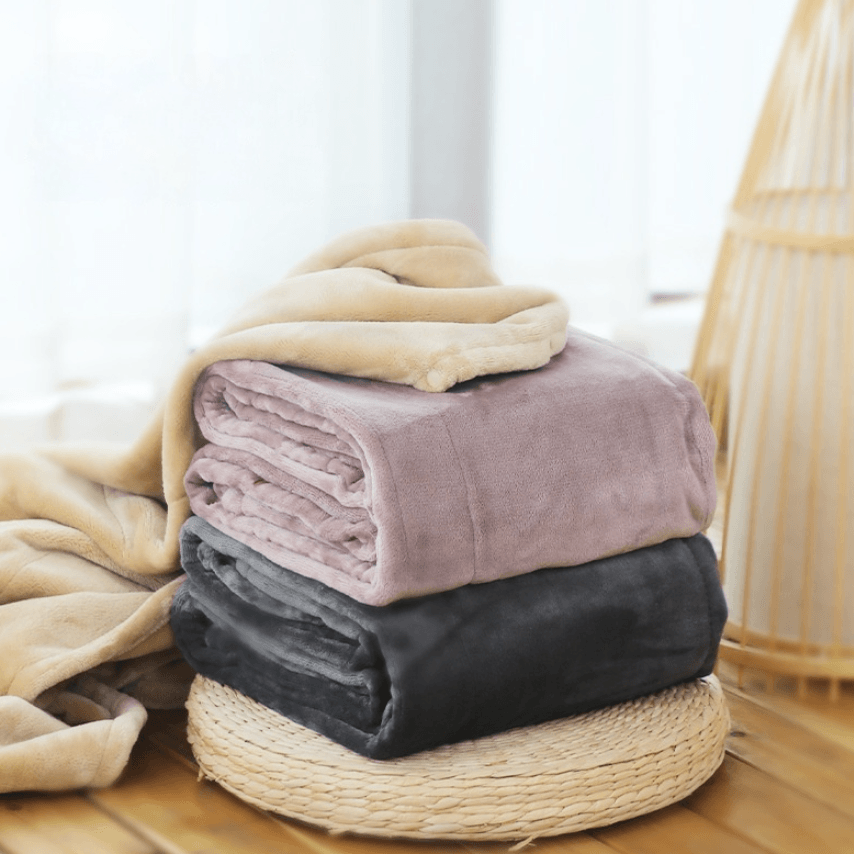 USB Heated electric blanket rolled up with USB power connector for warmth and comfort anywhere.